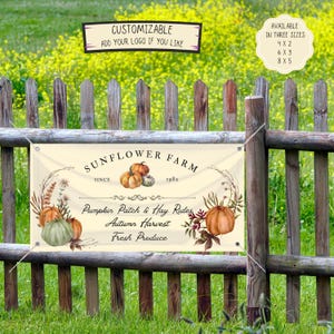 May include: A cream-colored banner with the text "Sunflower Farm" and "Pumpkin Patch & Hay Rides." The banner features watercolor pumpkins and floral accents. The banner is displayed on a wooden fence in front of a field of yellow flowers. Available in three sizes.