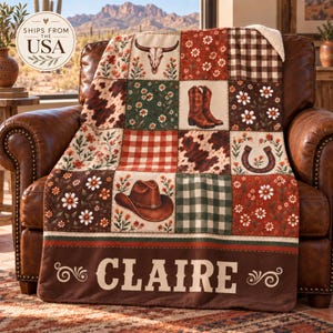 May include: A patchwork throw blanket featuring a cow skull, cowboy boots, a cowboy hat, horseshoes, floral patterns, and brown plaid squares. The bottom border is dark brown with the name CLAIRE printed in large, light-colored capital letters.
