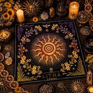May include: A black square altar cloth with a central sun design in shades of gold and orange, surrounded by floral and celestial motifs. The word "LITHA" is printed at the bottom. The cloth is part of a spiritual or Wiccan theme.