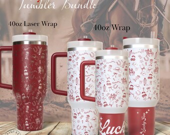 May include: A collection of red and white insulated tumblers with rodeo-themed designs. The tumblers feature images of horseshoes, cowboy hats, and other western motifs. The text "Lucky Rodeo Red Tumbler Bundle" is displayed at the top.