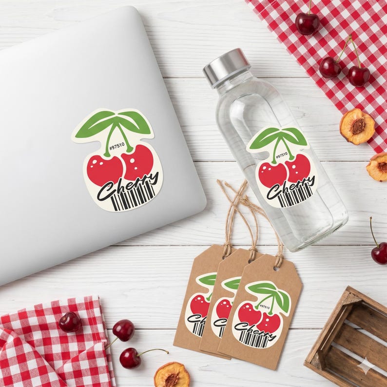 May include: A clear water bottle, laptop, and tags feature a cherry design with red fruit, green leaves, and the word "Cherry" in a script font. The design includes a barcode and the number "97510".