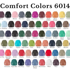 a variety of colorful t-shirt designs, each with a different color and pattern, arranged in a grid format.