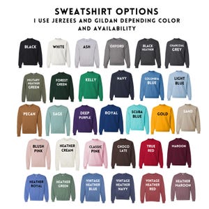 a collection of various colored sweatshirts, each with different designs and patterns, arranged in a grid format.