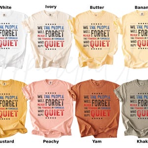 May include: A collection of short-sleeved t-shirts in various colors, including white, ivory, and mustard. Each shirt displays the text "WE THE PEOPLE WILL NEVER FORGET THE COWARDS IN CONGRESS WHO KEPT QUIET" in a patriotic design.