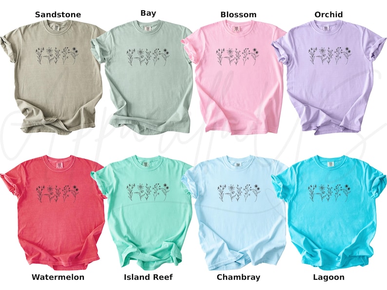 May include: Ten different coloured t-shirts with a simple floral design and the colour name printed below each shirt. The colours are Sandstone, Bay, Blossom, Orchid, Watermelon, Island Reef, Chambray, Lagoon.