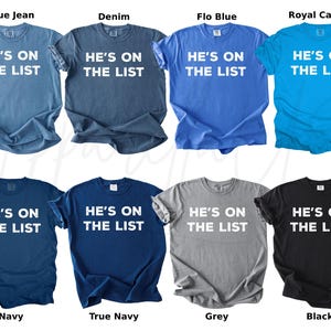 May include: Eight t-shirts in a range of colours: blue jean, denim, flo blue, royal caribe, navy, true navy, grey, and black. Each shirt features the white text "HE'S ON THE LIST".