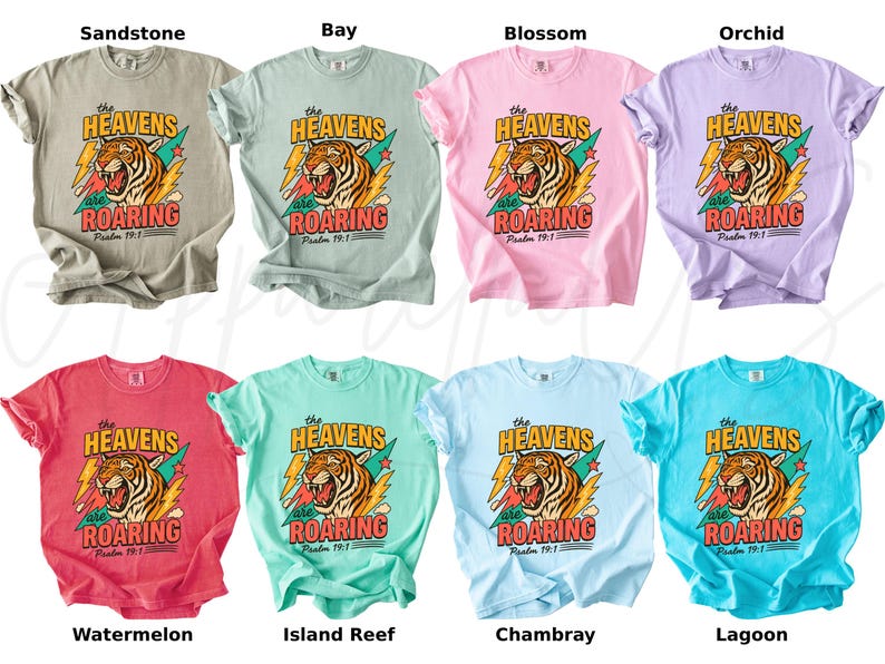 May include: A collection of eight t-shirts in various colors, each featuring a tiger graphic with the text "The Heavens are Roaring" and "Psalm 19:1". Colors include beige, light green, pink, purple, red, teal, light blue, and turquoise.