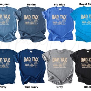 May include: A collection of t-shirts in various colors, including blue jean, denim, navy, and black. Each shirt features the text "DAD TAX" in a distressed font, along with a graphic of food items. The shirts are short-sleeved.