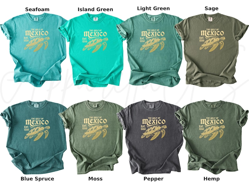 May include: Ten different color t-shirts with a vintage-style graphic of a sea turtle and the text "The Gulf of Mexico Est. 1900". The colors are seafoam, island green, light green, sage, blue spruce, moss, pepper, hemp, and two shades of green.