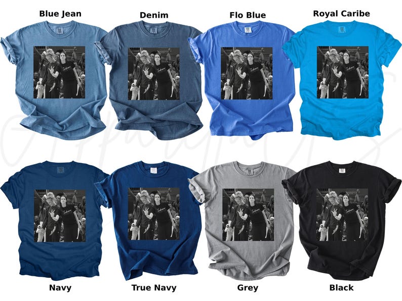 May include: A collection of eight t-shirts in various colors, including blue, navy, grey, and black. Each shirt features a black and white image of a group of people. The shirts are short-sleeved and have a crew neck.