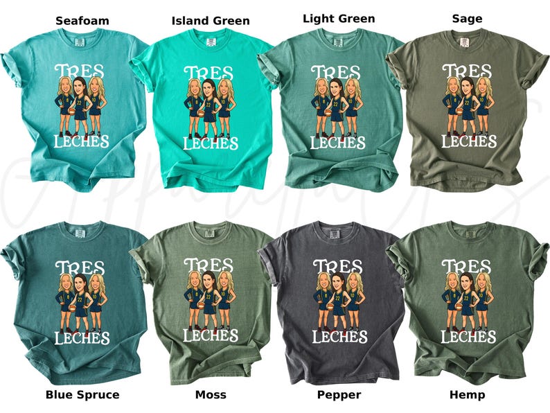 May include: A collection of eight t-shirts in various colors, including seafoam, island green, and sage. Each shirt features a graphic of three women and the text "TRES LECHES" in white. The shirts are short-sleeved.