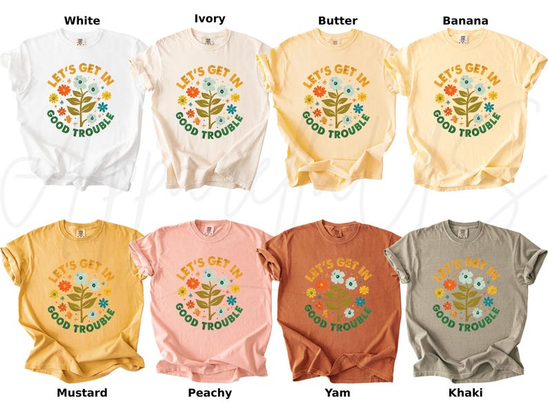 Peut inclure: Huit t-shirts de diff&eacute;rentes couleurs, dont blanc, ivoire, beurre, banane, moutarde, p&ecirc;che, igname et kaki. Chaque t-shirt pr&eacute;sente un motif floral avec le texte "LET'S GET IN GOOD TROUBLE" dans un style r&eacute;tro.