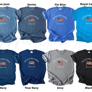 May include: A collection of eight t-shirts in various colors, including blue, navy, grey, and black. Each shirt features the text "REJECTING KINGS" above an American flag graphic, with "SINCE 1776" below. The shirts are displayed on a white background.