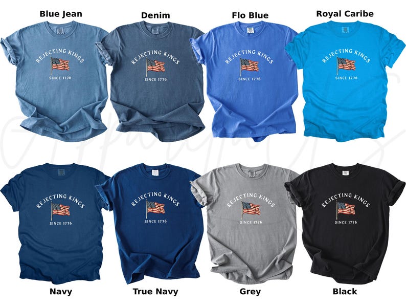 May include: A collection of eight t-shirts in various colors, including blue, navy, grey, and black. Each shirt features the text "REJECTING KINGS" above an American flag graphic, with "SINCE 1776" below. The shirts are displayed on a white background.