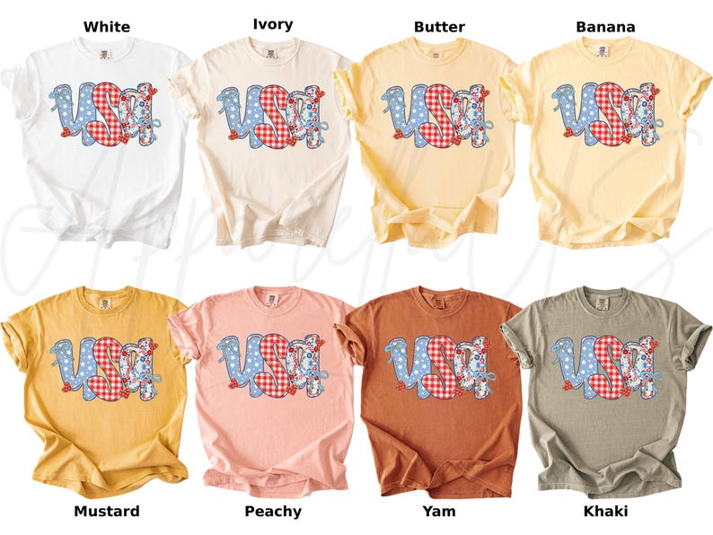 May include: A collection of eight t-shirts in various colors, including white, ivory, butter, banana, mustard, peachy, yam, and khaki. Each shirt features the word "USA" in a playful design with blue polka dots and red gingham patterns.