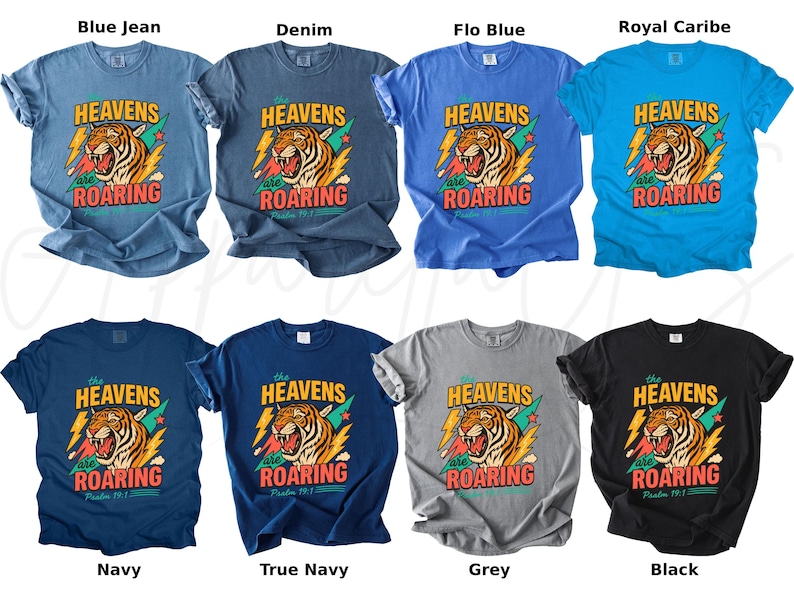 May include: A collection of t-shirts in various colors, including blue, navy, grey, and black. Each shirt features a graphic of a roaring tiger with the text "HEAVENS are ROARING" and "Psalm 19:1".