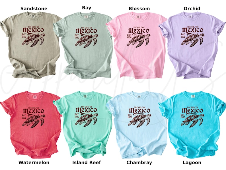 May include: A set of ten t-shirts in various colors featuring a graphic of a sea turtle with the text "The Gulf of Mexico Est. 1500". The colors include sandstone, bay, blossom, orchid, watermelon, island reef, chambray, and lagoon.