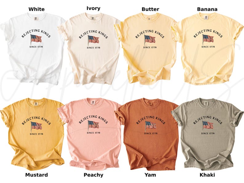 May include: A collection of eight t-shirts in various colors, including white, ivory, butter, banana, mustard, peachy, yam, and khaki. Each shirt features the text "REJECTING KINGS SINCE 1776" above an American flag graphic.