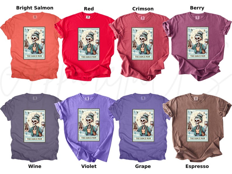 May include: A collection of eight t-shirts in various colors, including bright salmon, red, crimson, berry, wine, violet, grape, and espresso. Each shirt features a graphic of a skeleton with ballet shoes and a coffee cup, with the text "THE DANCE MOM".