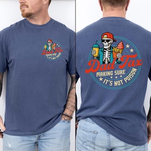 May include: A blue t-shirt with a graphic on the front and back. The front graphic shows a skeleton with a drink and fries, with text reading "Dad Tax" and "Making Sure It's Not Poison." The back graphic is similar.