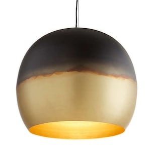 May include: A modern pendant light with a two-tone design. The top half is dark, transitioning to a gold-colored bottom. The light fixture is spherical and hangs from a black cord, creating a warm, inviting ambiance.