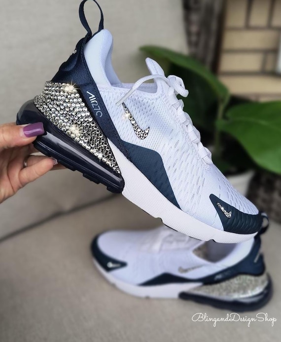 white nike shoes with teal swoosh