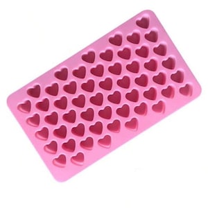 May include: Pink silicone mould with 48 heart-shaped cavities. The mould is rectangular and made of a flexible, food-grade material. Ideal for making chocolates, sweets, or ice cubes. Perfect for Valentine's Day or other special occasions.