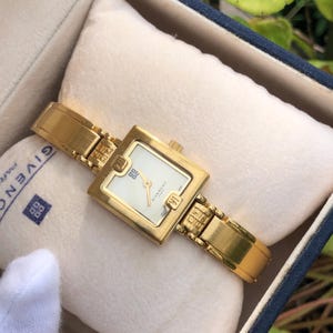RARE bracelet jonc GIVENCHY vintage modèle antique Swiss Made Version montre pour femme en acier inoxydable doré dans une boîte en bon état