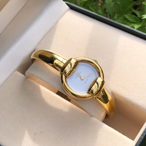 VINTAGE GUCCI 1400L gold plated bangle type lady’s horsebit watch white dial 16-17cm wrist Boxed Good Condition