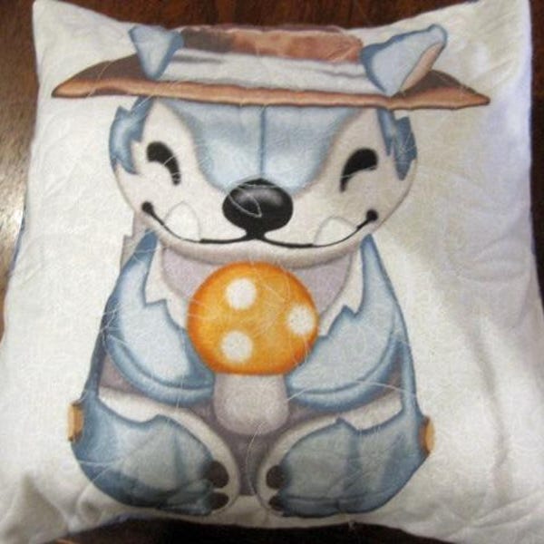 May include: A white pillow with a blue and gray cartoon character wearing a brown hat and holding a yellow mushroom with white spots. The character has a big smile and is looking to the right.