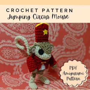 May include: A crochet pattern titled Jumping Circus Mouse featuring a small, handmade mouse doll wearing a red circus jacket and a matching red hat with a yellow star. The text CROCHET PATTERN Jumping Circus Mouse and PDF Amigurumi Pattern are visible.