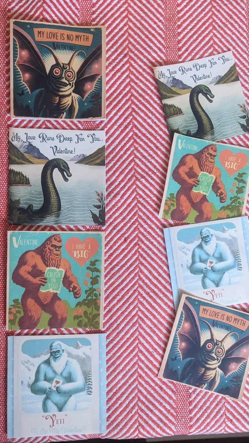 May include: A set of eight Valentine's Day cards featuring various mythical creatures. The cards are printed on a thick cardstock and feature colorful illustrations. The cards include a yeti, a bigfoot, a monster, and a sea serpent. The cards are perfect for sending to friends, family, or loved ones.