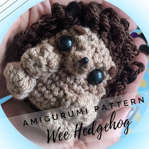 May include: A crocheted amigurumi hedgehog pattern, with the words "Amigurumi Pattern Wee Hedgehog" printed on the image.