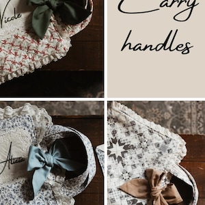 May include: Four fabric carry handles with bows and lace trim. The handles are decorated with names such as "Nicole" and "Alicia". The image also shows the text "Carry handles".