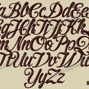 May include: An embroidered alphabet in a brown, elegant script font, displayed on a beige background. The image features both uppercase and lowercase letters. The text "8CP Yorn" is visible in the bottom right corner.