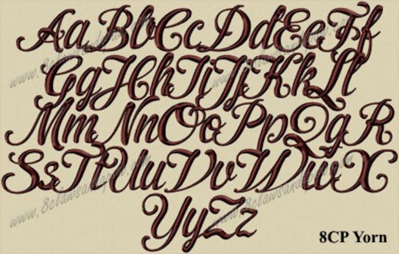 May include: An embroidered alphabet in a brown, elegant script font, displayed on a beige background. The image features both uppercase and lowercase letters. The text "8CP Yorn" is visible in the bottom right corner.