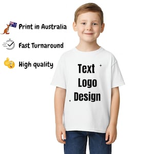 May include: A white short-sleeved t-shirt featuring the black text "Text Logo Design" centred on the chest, accented by two small four-pointed star icons. The shirt is paired with dark blue denim jeans.