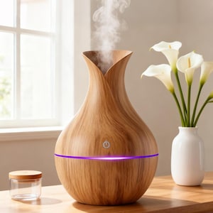 May include: A wood-grain essential oil diffuser with a purple light band. The diffuser has a vase-like shape with a petal-like opening at the top, emitting a stream of vapor. A small glass jar with a wooden lid sits to the left.