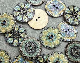 May include: A collection of decorative wooden buttons with intricate floral and mandala designs in shades of blue, yellow, and teal. One plain, unfinished button is also present. These buttons are ideal for sewing and craft projects.
