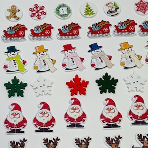 May include: A collection of small, flat, decorative buttons featuring various Christmas-themed designs including Santa Claus, snowmen, reindeer, stockings, snowflakes, Christmas trees, ornaments, candy canes, and mittens in red, green, and white.