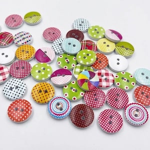 May include: A collection of colorful, round wooden buttons with various patterns, including polka dots, plaid, and geometric designs. The buttons are in shades of red, green, yellow, and blue, each with two or three holes for sewing.