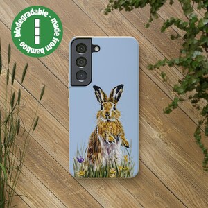 May include: A blue phone case with a brown rabbit illustration and a green bamboo logo that says "made from bamboo - biodegradable".