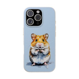 May include: A light blue phone case featuring a watercolor illustration of a hamster holding a seed. The hamster has orange, brown, and white fur. The case has a clear border and a camera cutout.