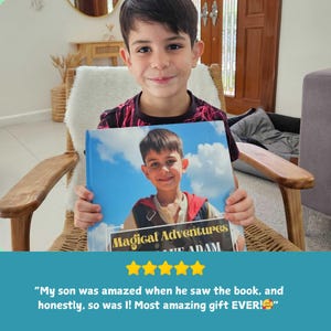 May include: A young boy holding a book titled "Magical Adventures". The book cover features a photo of the boy against a blue sky background. The boy is smiling, and the image includes a five-star rating.
