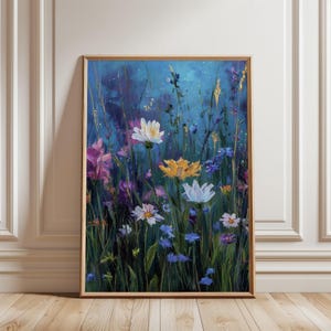 May include: A framed painting of a wildflower meadow. The artwork features a vibrant array of colorful flowers in shades of white, yellow, purple, and blue against a dark blue background. The painting is in a wooden frame.