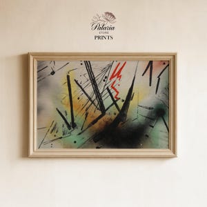 May include: Abstract art print in a light wood frame. The artwork features a mix of black, red, yellow, and green colors with a variety of lines and shapes. The text "Palaria Store Prints" is visible at the top.