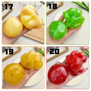 May include: A collection of four sets of two fruit-shaped silicone or resin items labeled 17, 18, 19, and 20. Set 17 is yellow, 18 is green, 19 is orange-yellow, and 20 is red. Each set features one round and one irregular, textured fruit shape.
