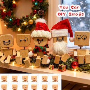 May include: Wooden emoji figures with interchangeable faces, some wearing Santa hats and scarves, arranged on a shelf with Christmas decorations. The text "You Can DIY Emojis" is visible.