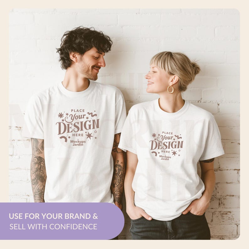 May include: Two people wearing white t-shirts with the text "PLACE Your DESIGN HERE Mockups Jardin" printed on the front. The text is in a brown color with a whimsical font.