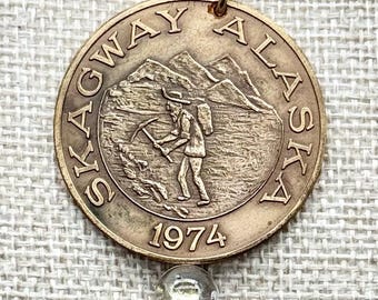 Ficha de dólar comercial de Skagway, Alaska, de 1974, conmemorativa de la entrada al Klondike.